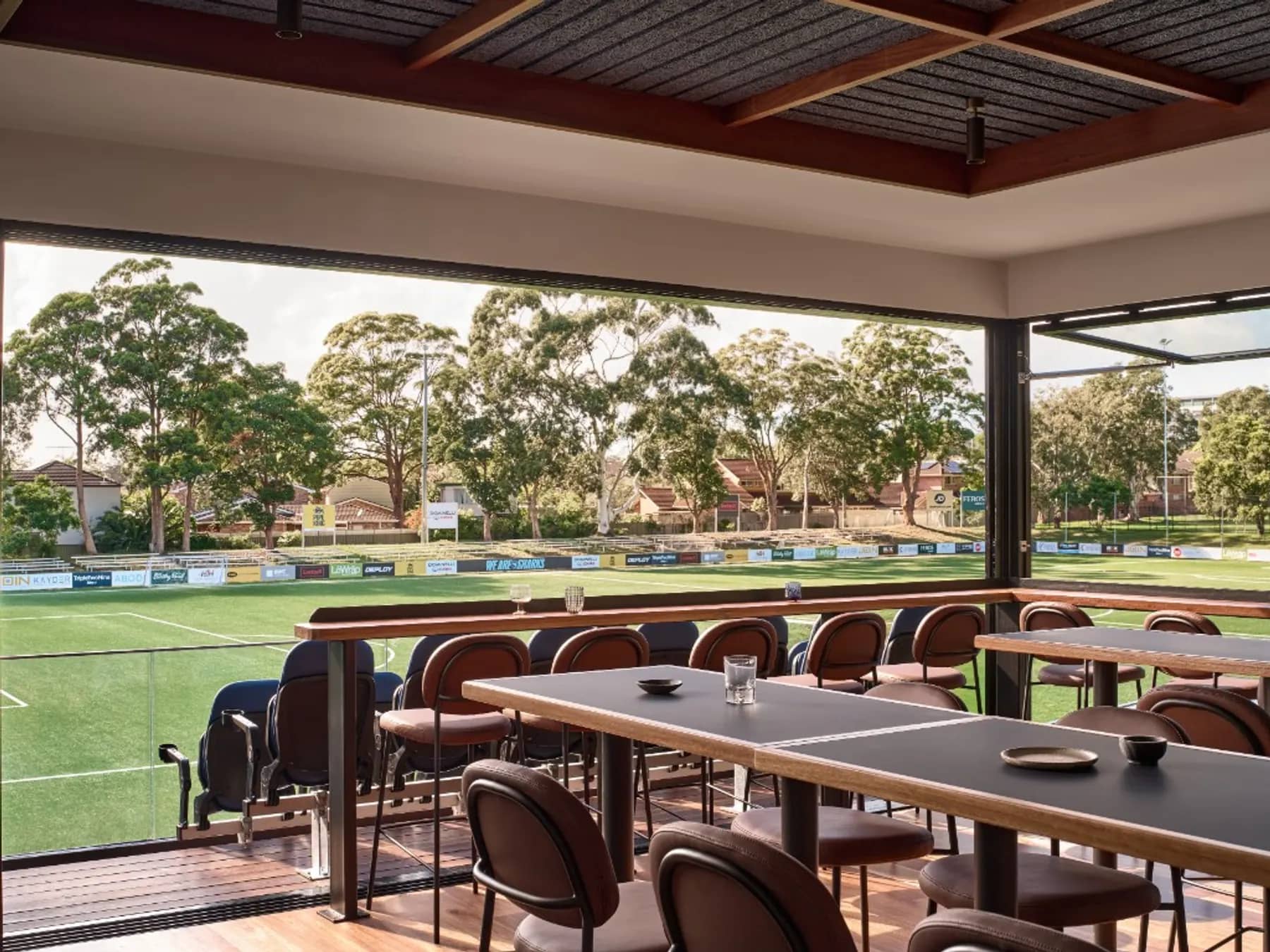 Padded seats on the Founders Club balcony, looking straight down onto the Seymour Shaw pitch